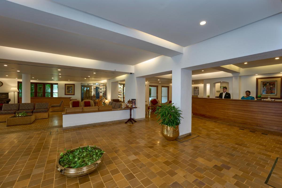a lobby of a hotel with a waiting room at Casino Hotel - CGH Earth, Cochin in Cochin
