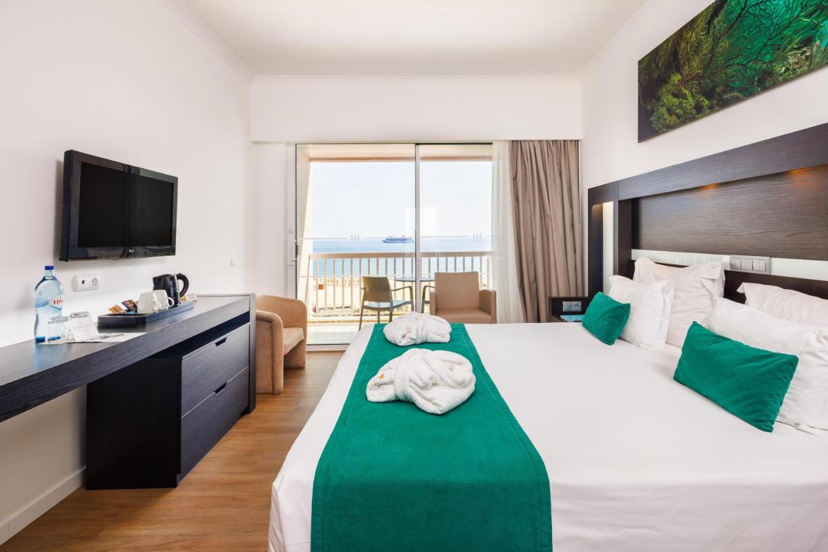 Uma cama ou camas num quarto em Jupiter Algarve Hotel - Beach & Spa