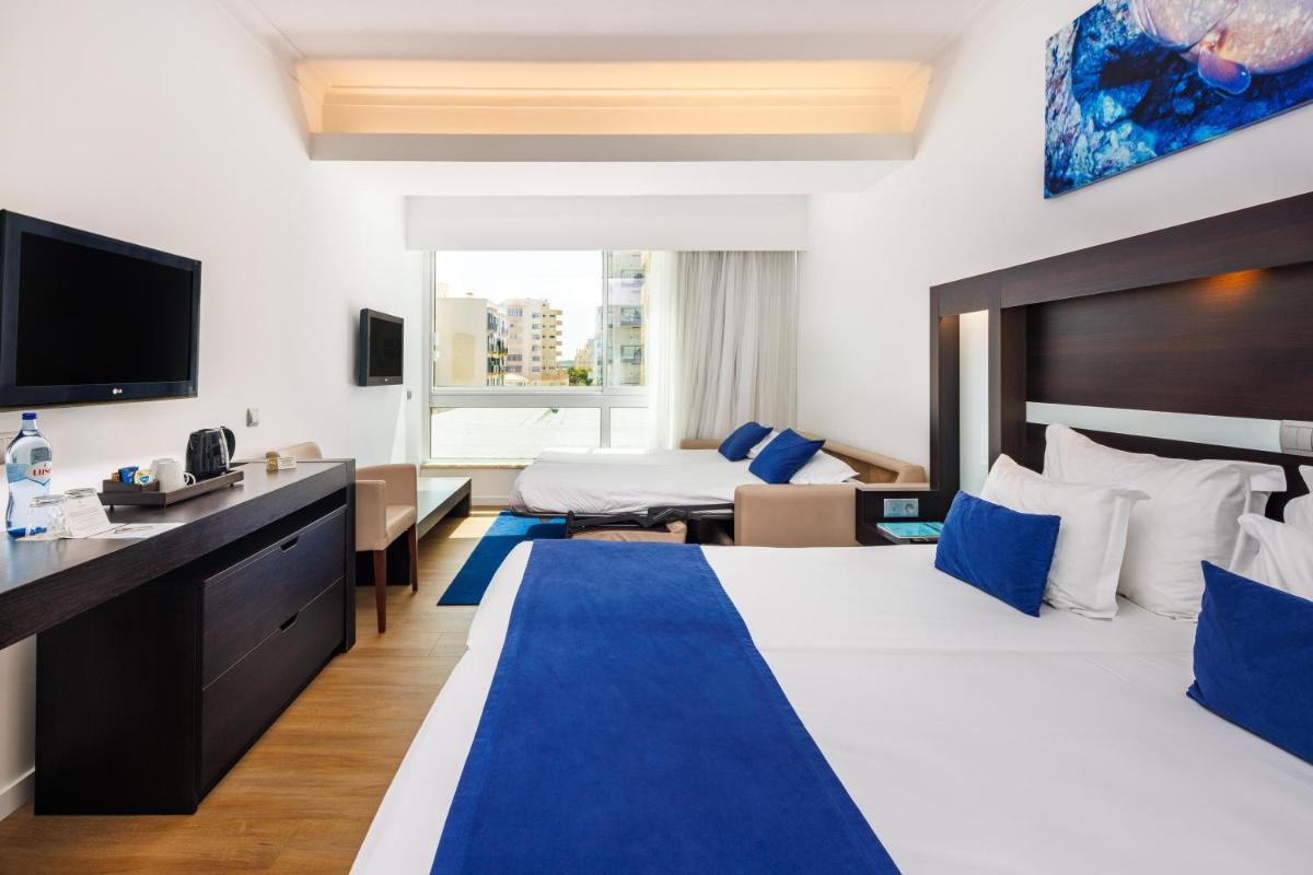 Uma cama ou camas num quarto em Jupiter Algarve Hotel - Beach & Spa