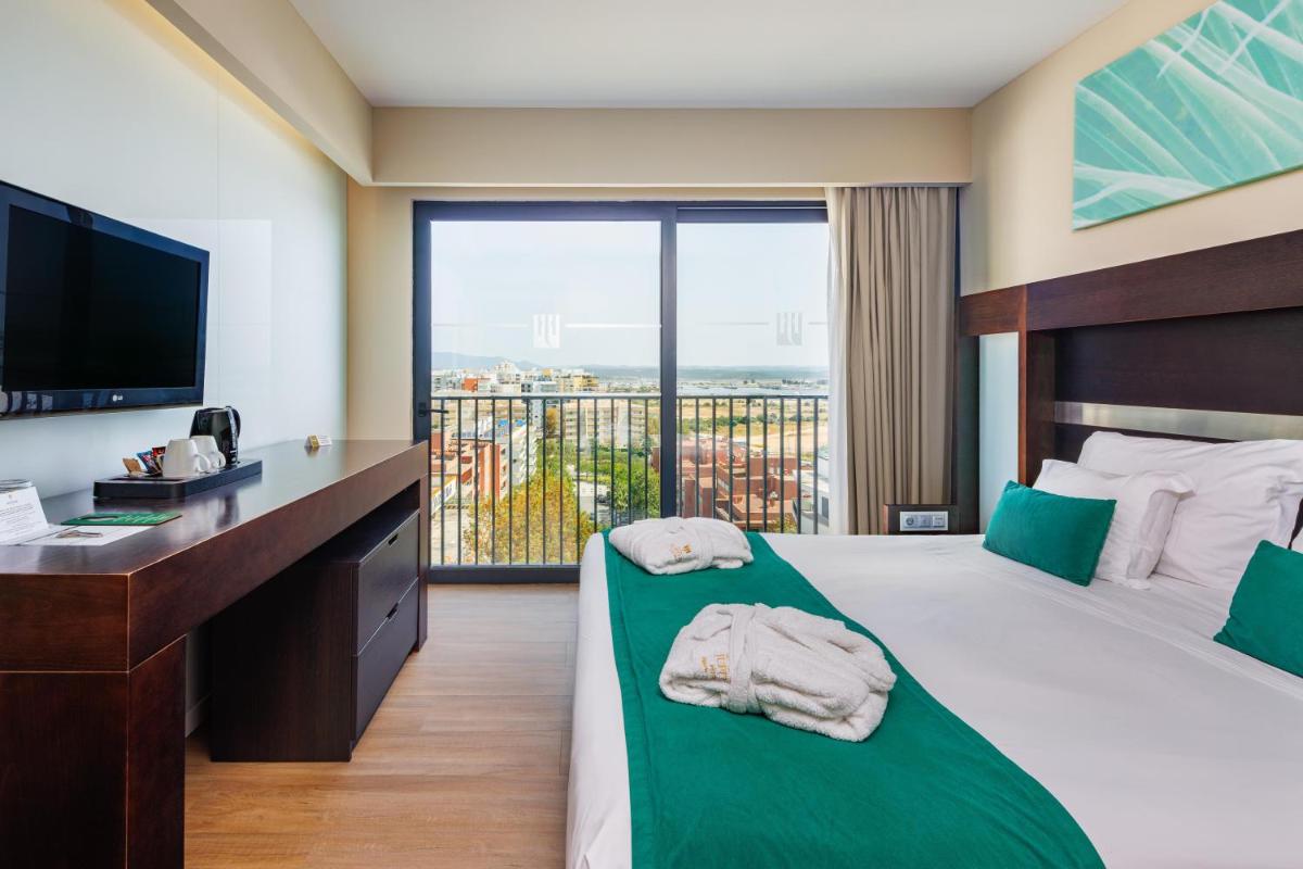 Uma cama ou camas num quarto em Jupiter Algarve Hotel - Beach & Spa