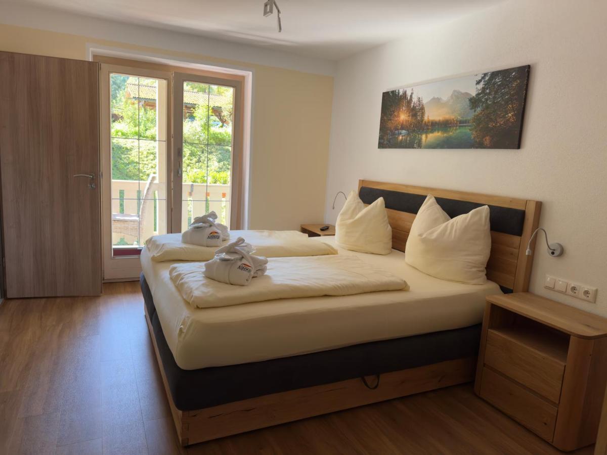 Ein Bett oder Betten in einem Zimmer der Unterkunft Alpenglühn Apartments - Adult Only