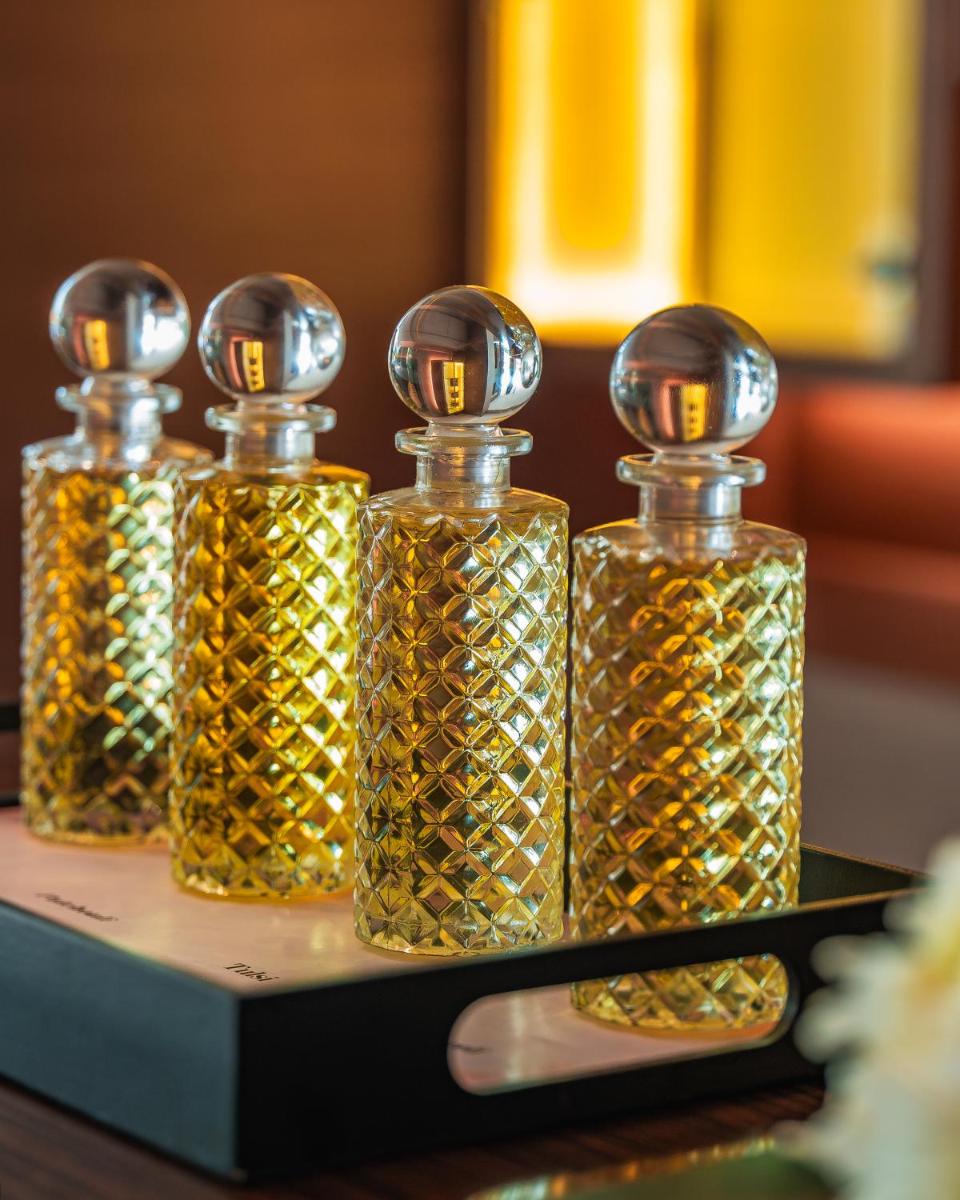 three bottles of oil sitting on a table at Hyatt Pune in Pune