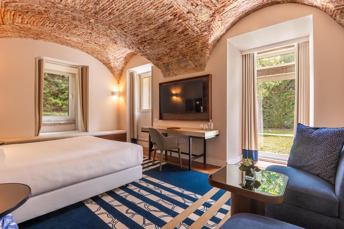 Uma cama ou camas num quarto em Palácio do Governador - Lisbon Hotel & Spa