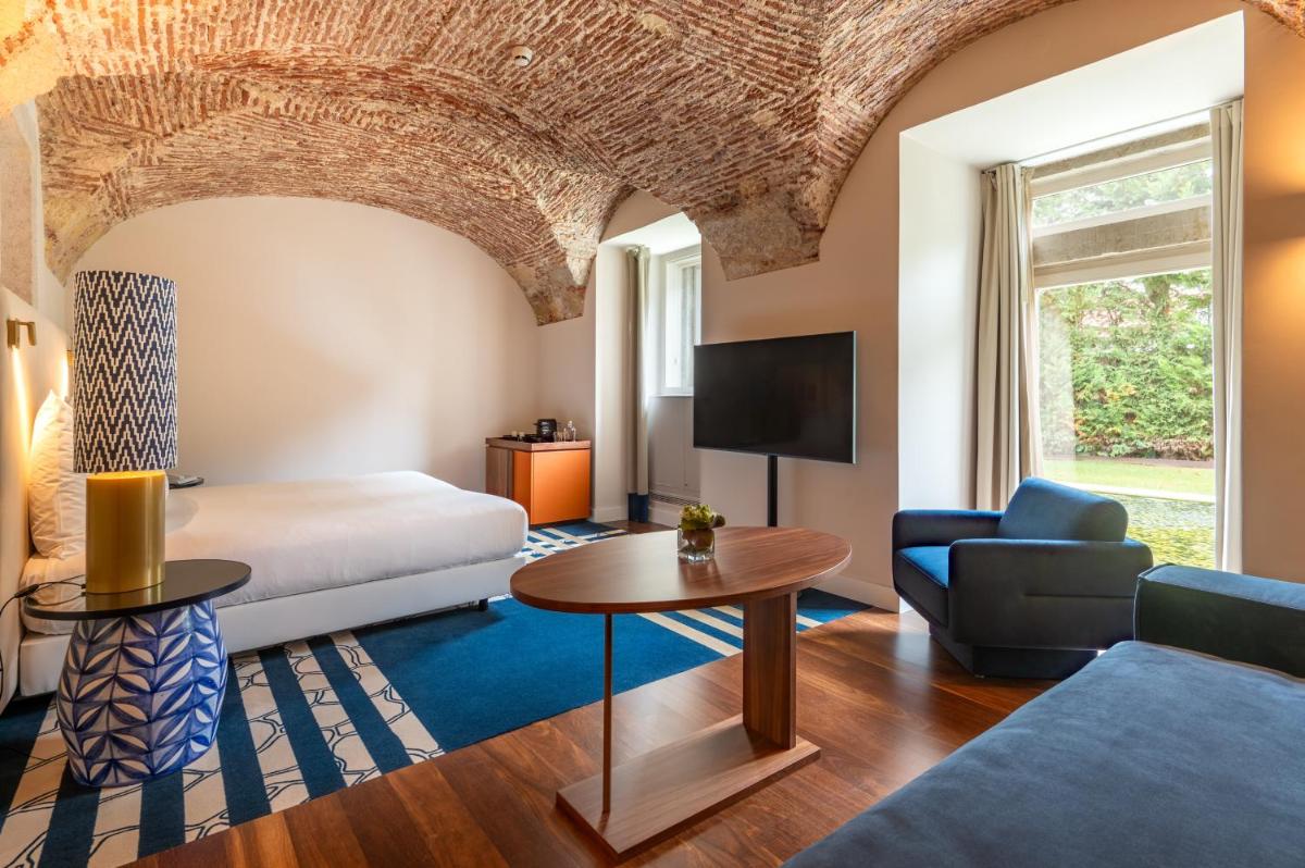 Uma cama ou camas num quarto em Palácio do Governador - Lisbon Hotel & Spa