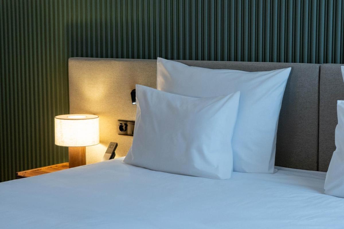 Uma cama ou camas num quarto em The Lince Braga