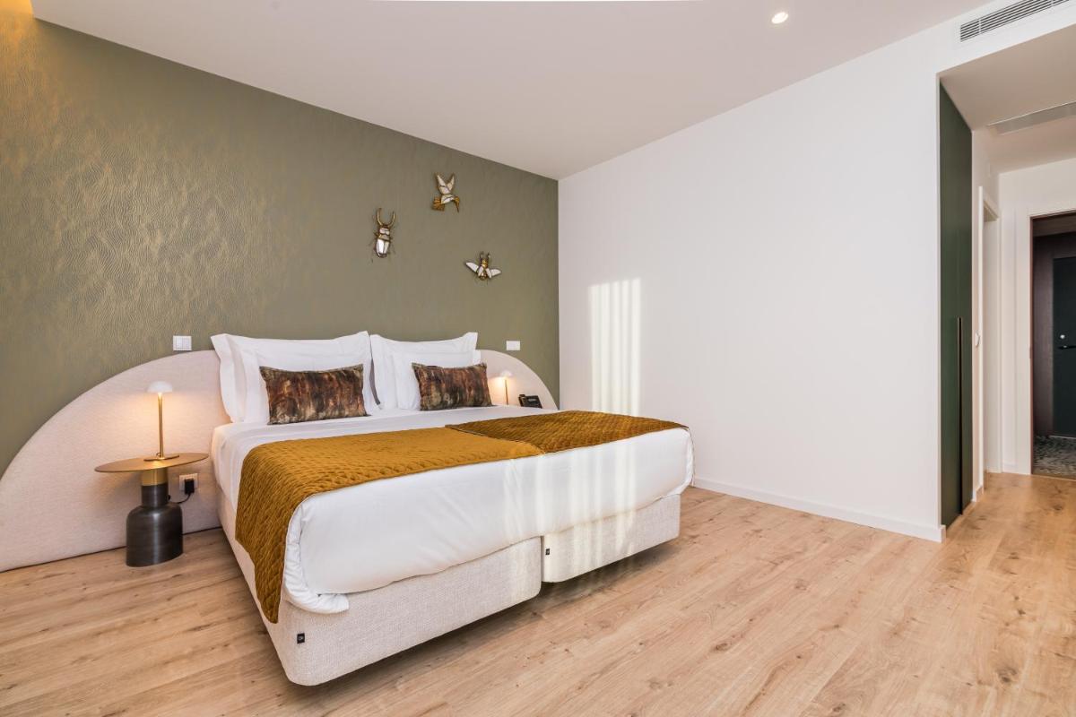 Uma cama ou camas num quarto em Haven Nature Hotel & Villas