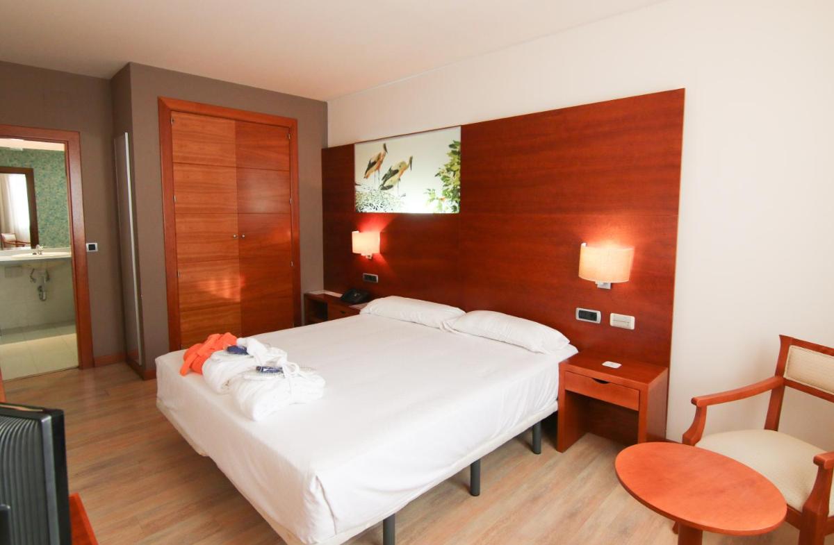 Cama o camas de una habitación en Hotel Balneario Valle del Jerte