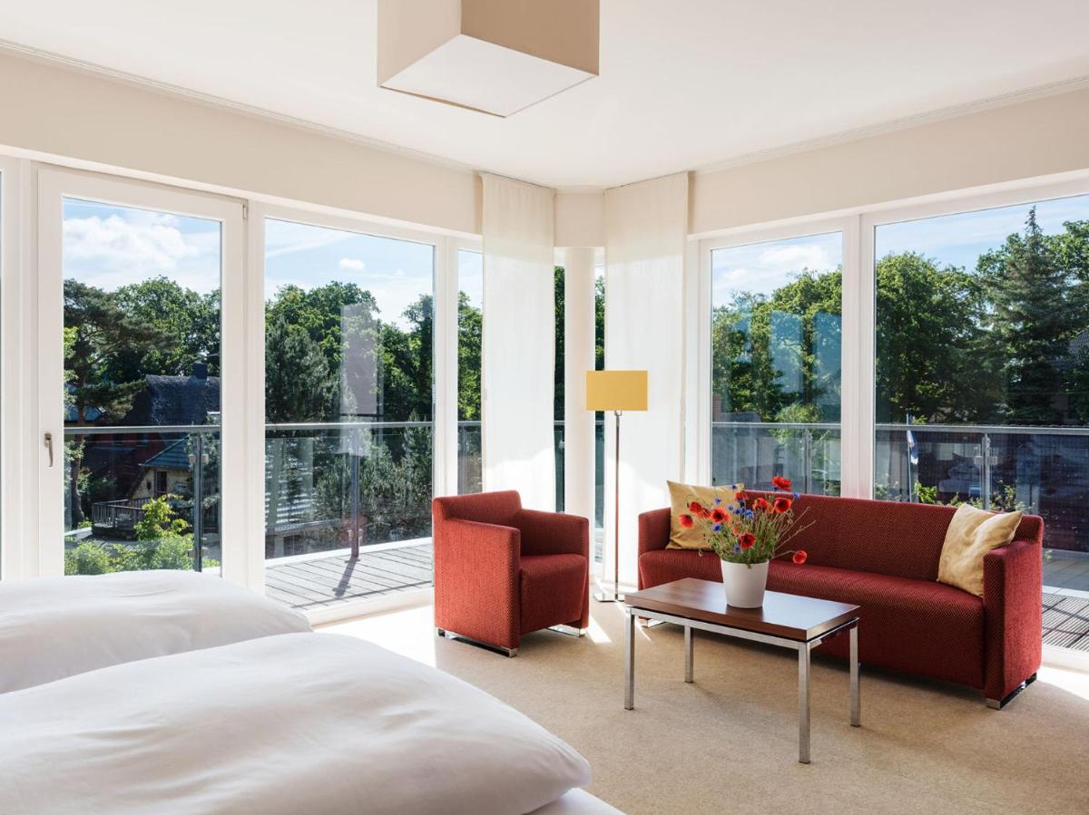 Ein Bett oder Betten in einem Zimmer der Unterkunft THE GRAND Ahrenshoop