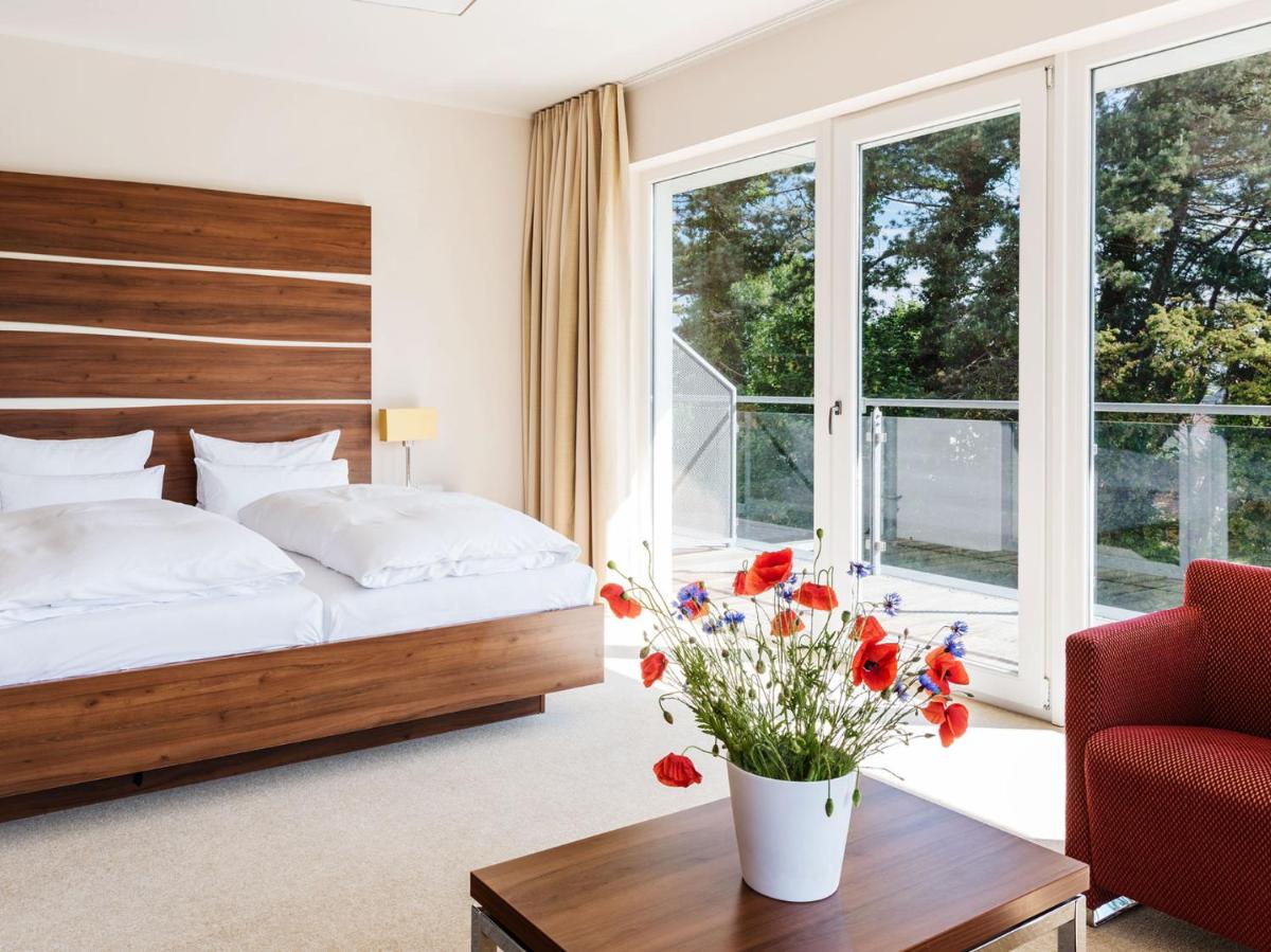 Ein Bett oder Betten in einem Zimmer der Unterkunft THE GRAND Ahrenshoop