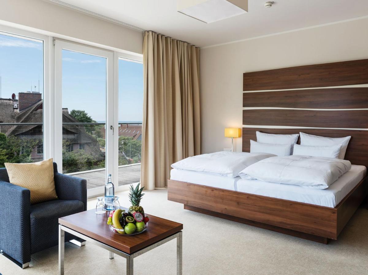 Ein Bett oder Betten in einem Zimmer der Unterkunft THE GRAND Ahrenshoop