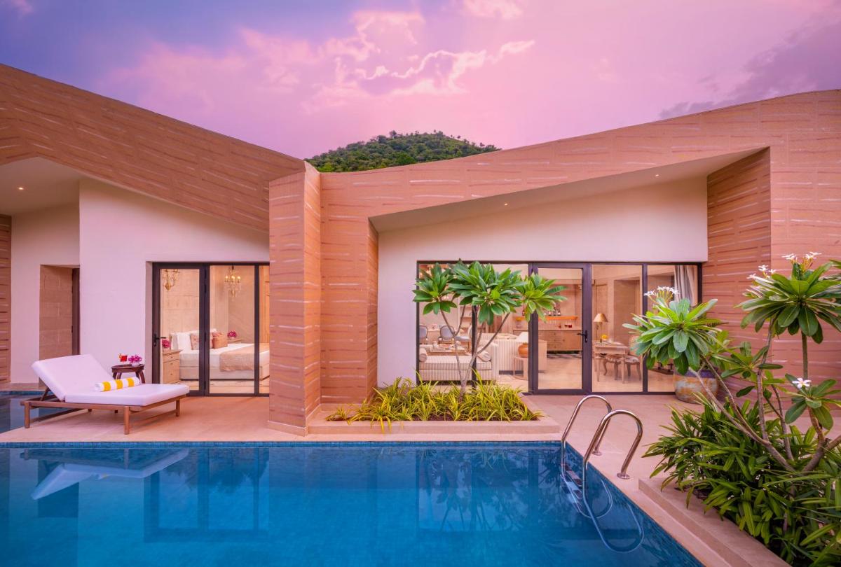 an image of a villa with a swimming pool at Taj Aravali Resort & Spa Udaipur in Udaipur