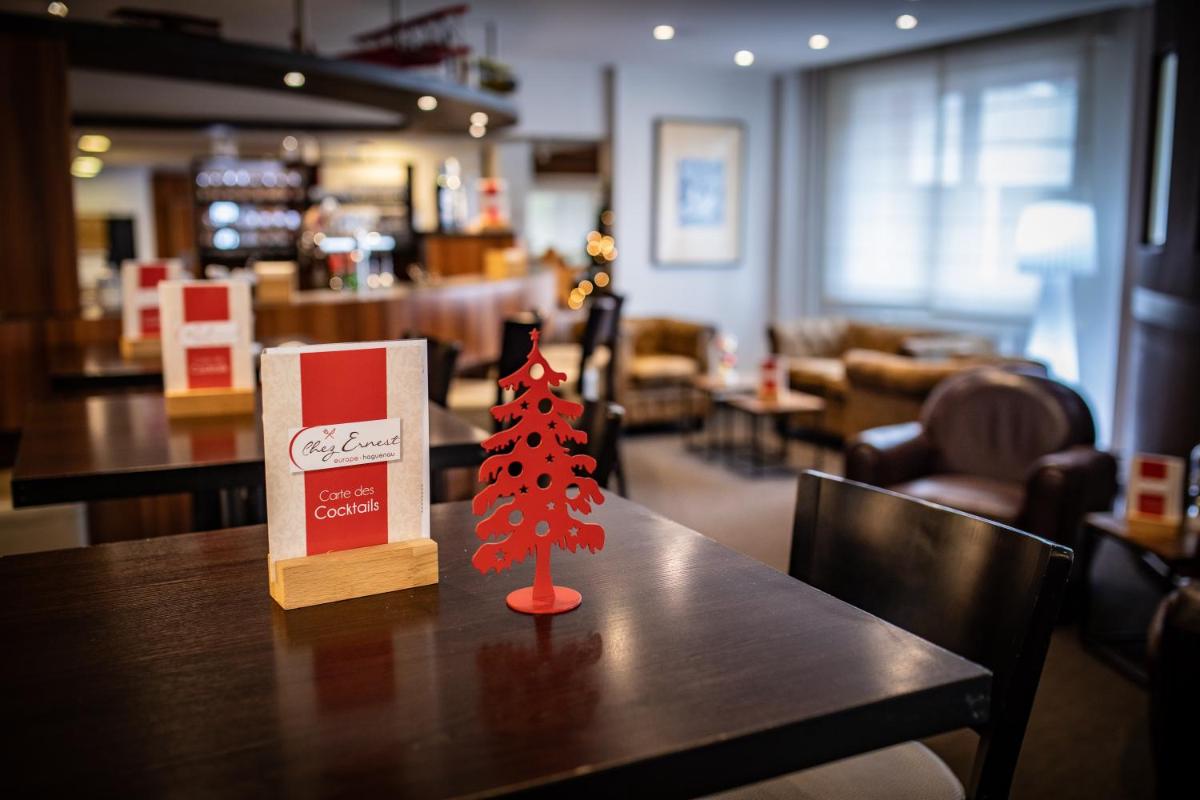 Coin salon dans l'établissement Europe Haguenau – Hotel & Spa