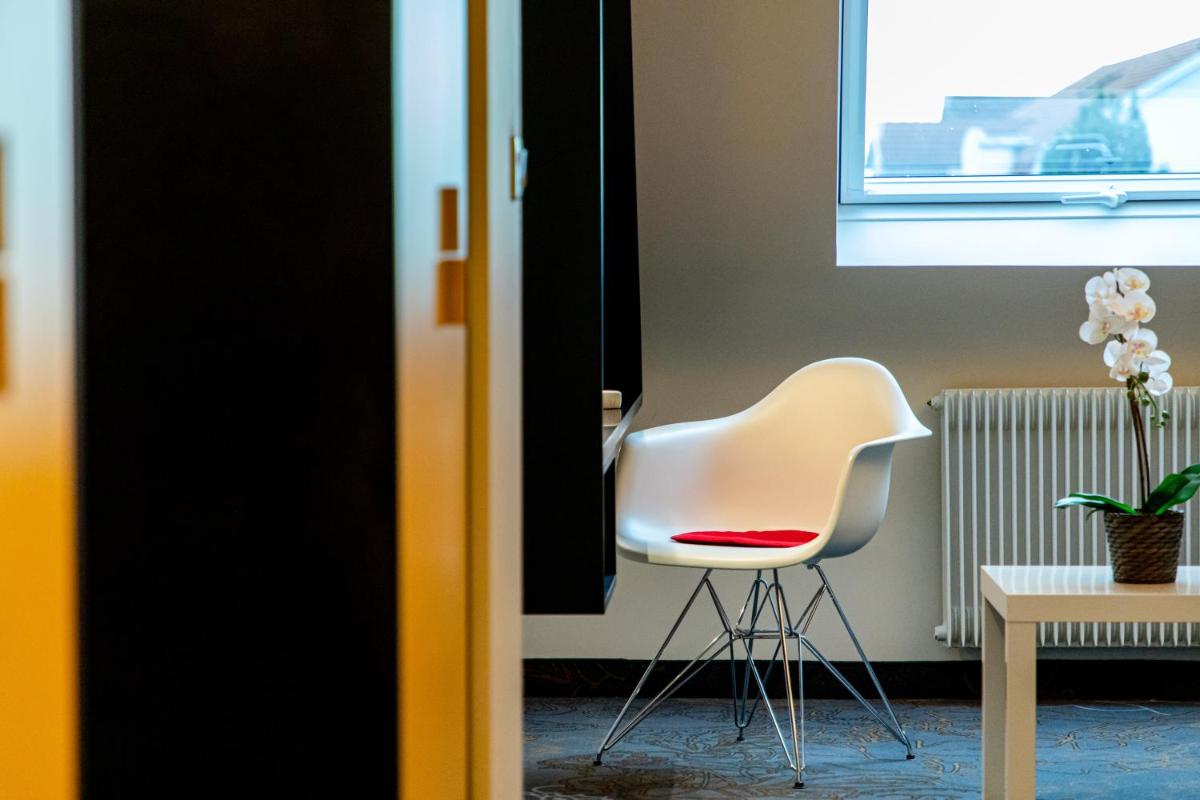 Coin salon dans l'établissement Europe Haguenau – Hotel & Spa