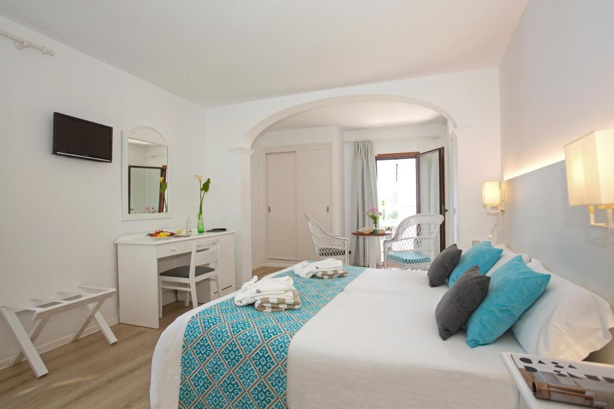 Cama o camas de una habitación en Hotel Marina