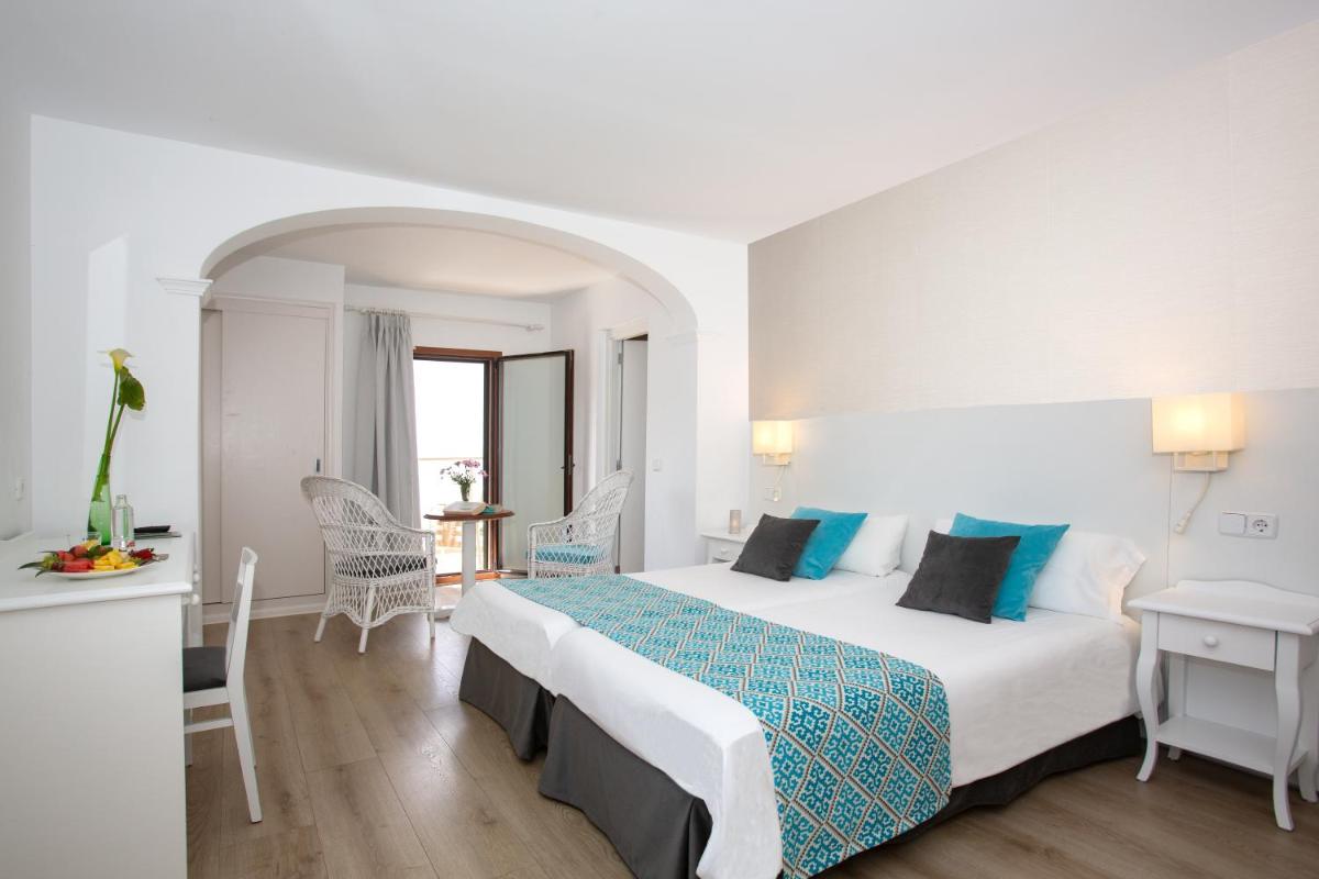 Cama o camas de una habitación en Hotel Marina