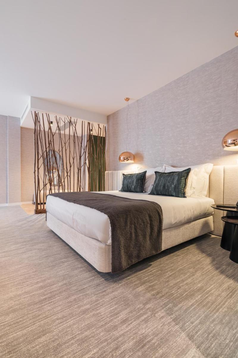 Uma cama ou camas num quarto em Haven Nature Hotel & Villas