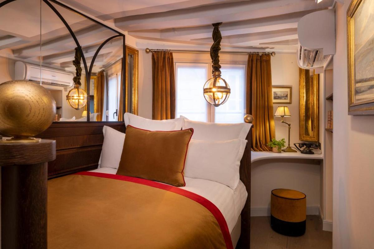 Un ou plusieurs lits dans un hébergement de l'établissement Hôtel Da Vinci & Spa