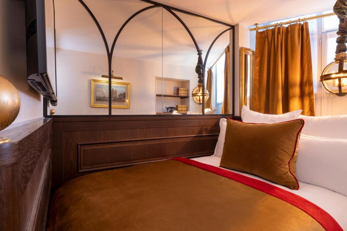 Un ou plusieurs lits dans un hébergement de l'établissement Hôtel Da Vinci & Spa