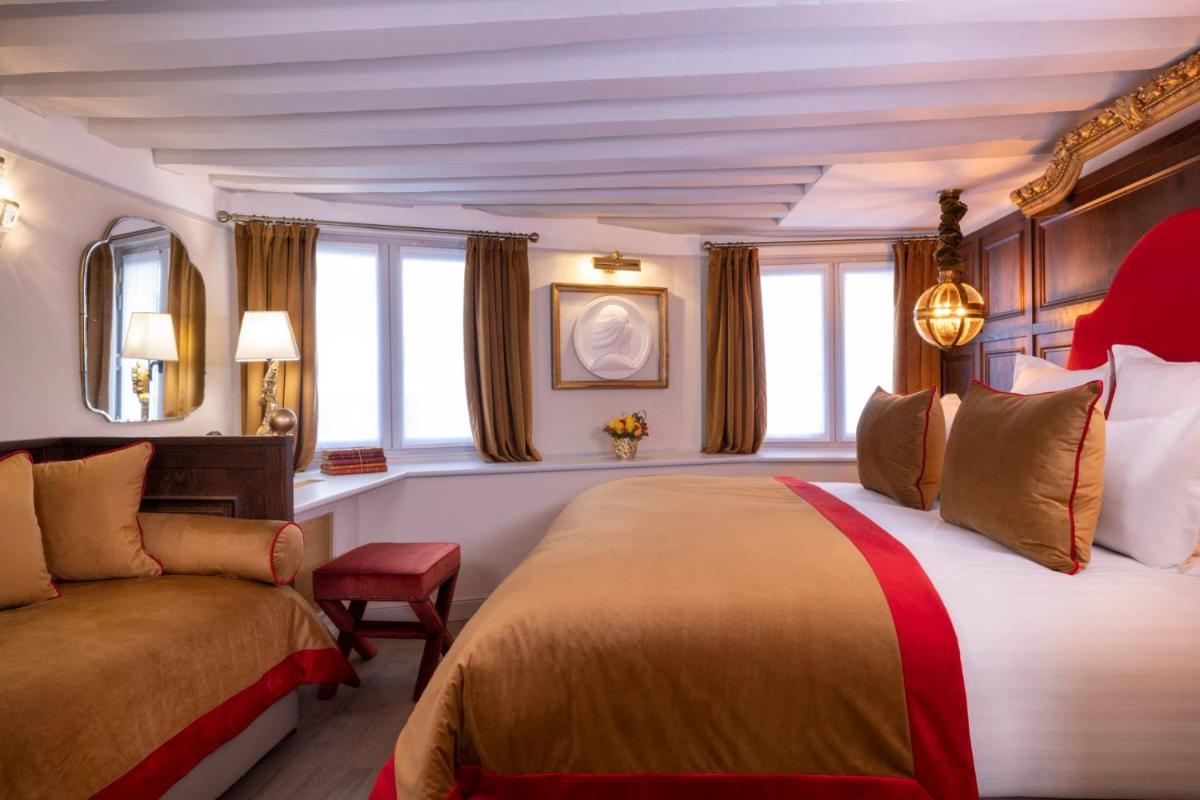 Un ou plusieurs lits dans un hébergement de l'établissement Hôtel Da Vinci & Spa