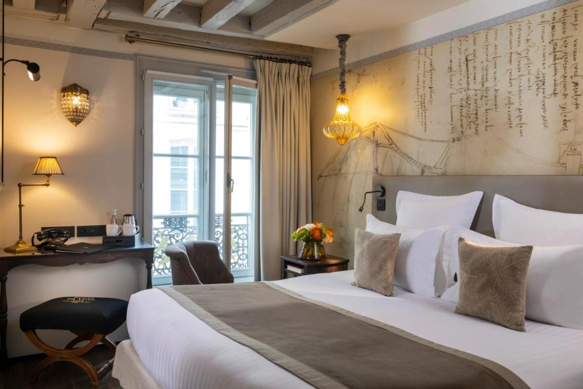 Un ou plusieurs lits dans un hébergement de l'établissement Hôtel Da Vinci & Spa