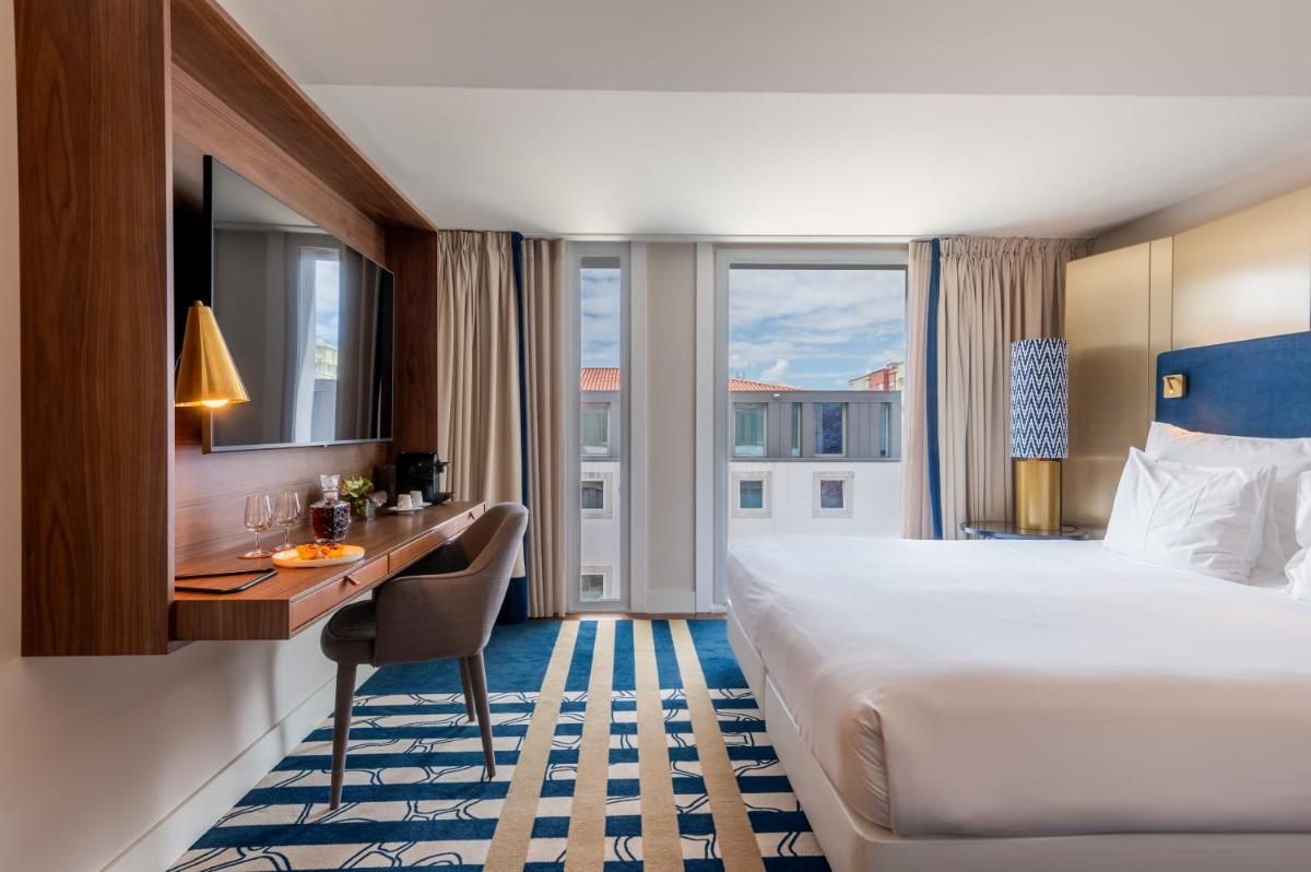 Uma cama ou camas num quarto em Palácio do Governador - Lisbon Hotel & Spa