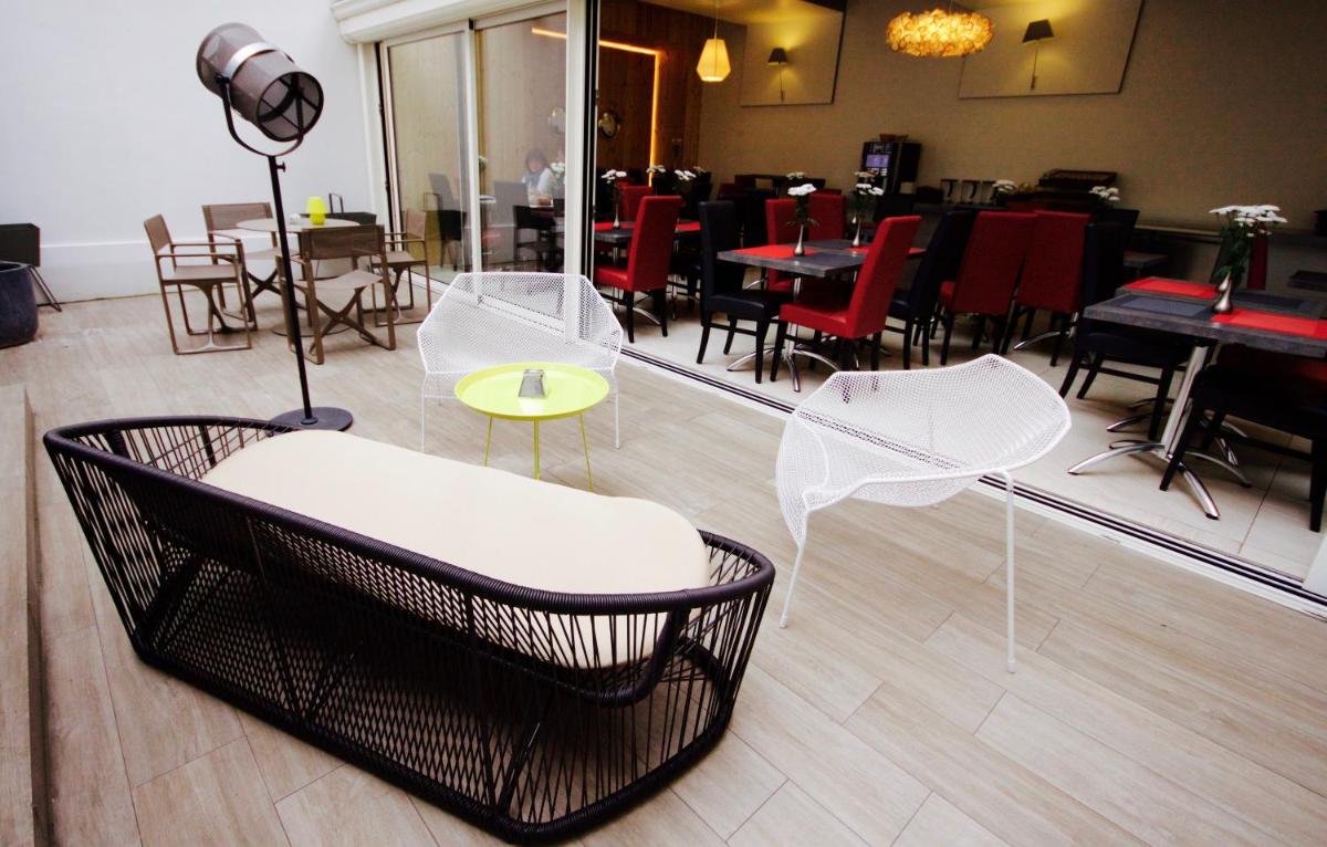 Coin salon dans l'établissement Hôtel Brésil Opéra SPA