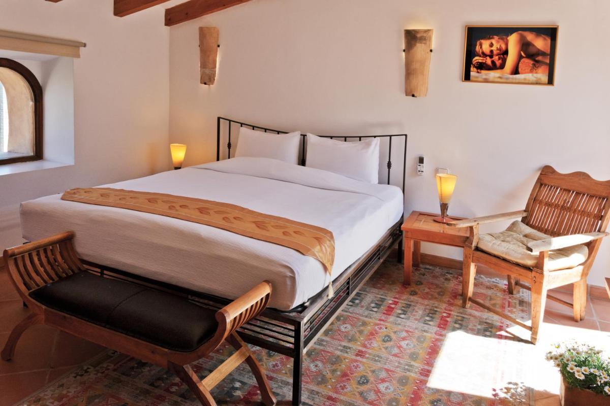 Cama o camas de una habitación en Hotel Can Roses