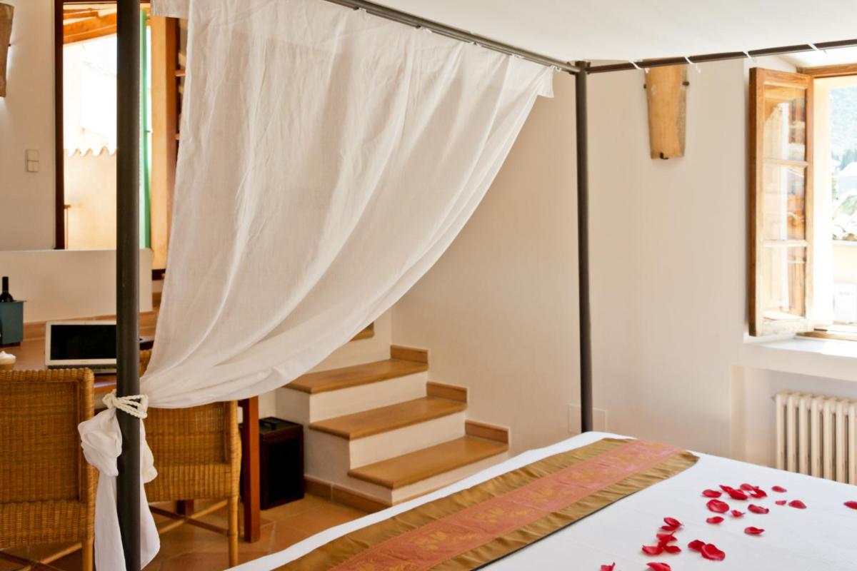Cama o camas de una habitación en Hotel Can Roses