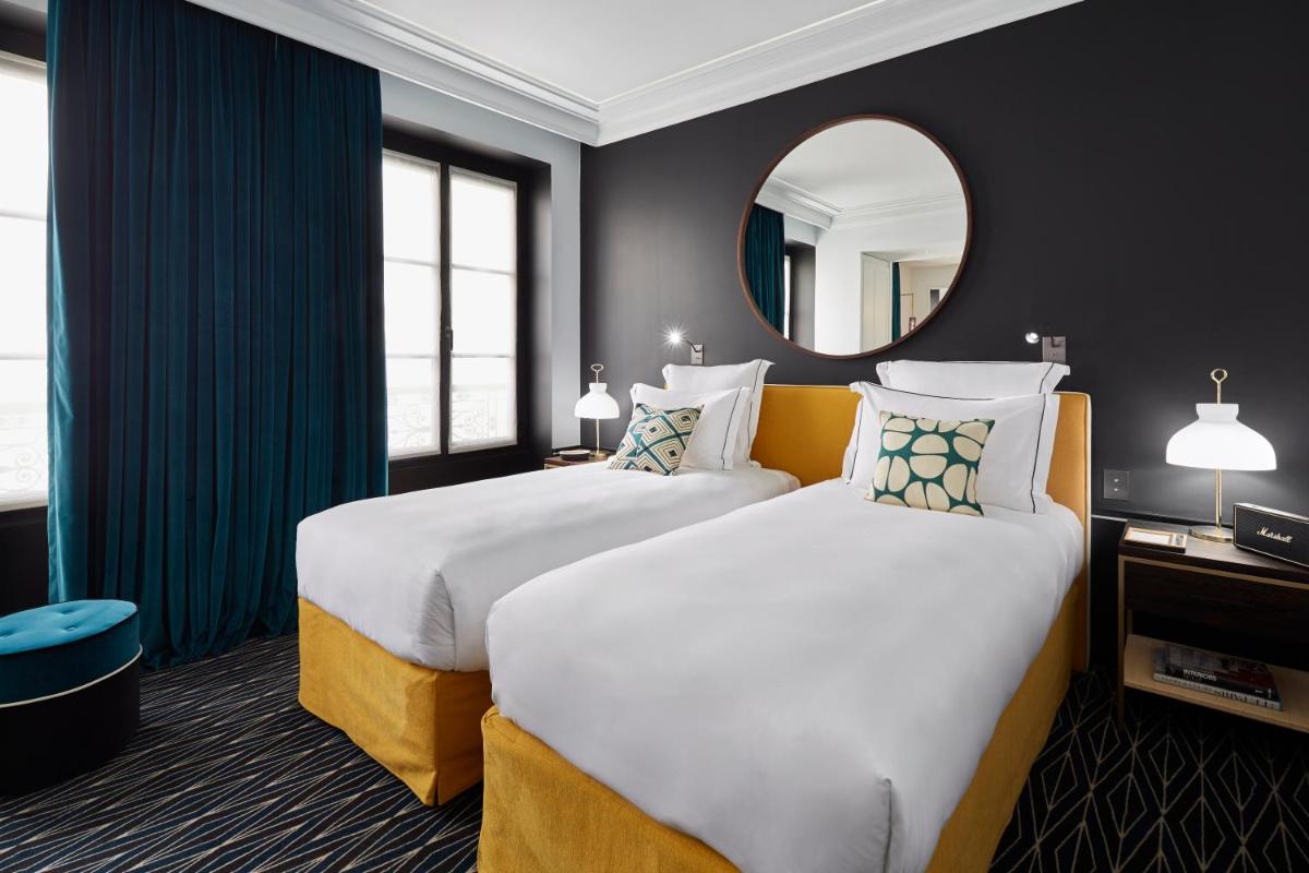 Un ou plusieurs lits dans un hébergement de l'établissement Le Roch Hotel & Spa