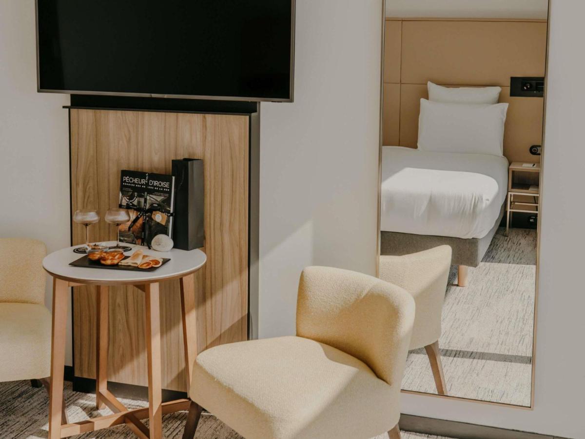 Un ou plusieurs lits dans un hébergement de l'établissement Sainte-Barbe Hotel & Spa Le Conquet - MGallery Collection