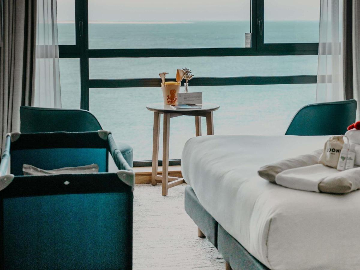 Un ou plusieurs lits dans un hébergement de l'établissement Sainte-Barbe Hotel & Spa Le Conquet - MGallery Collection