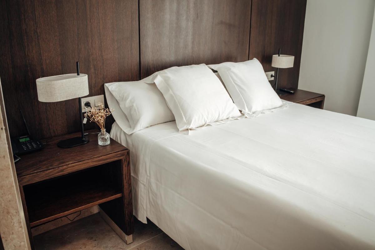 Cama o camas de una habitación en Hotel Alba Seleqtta