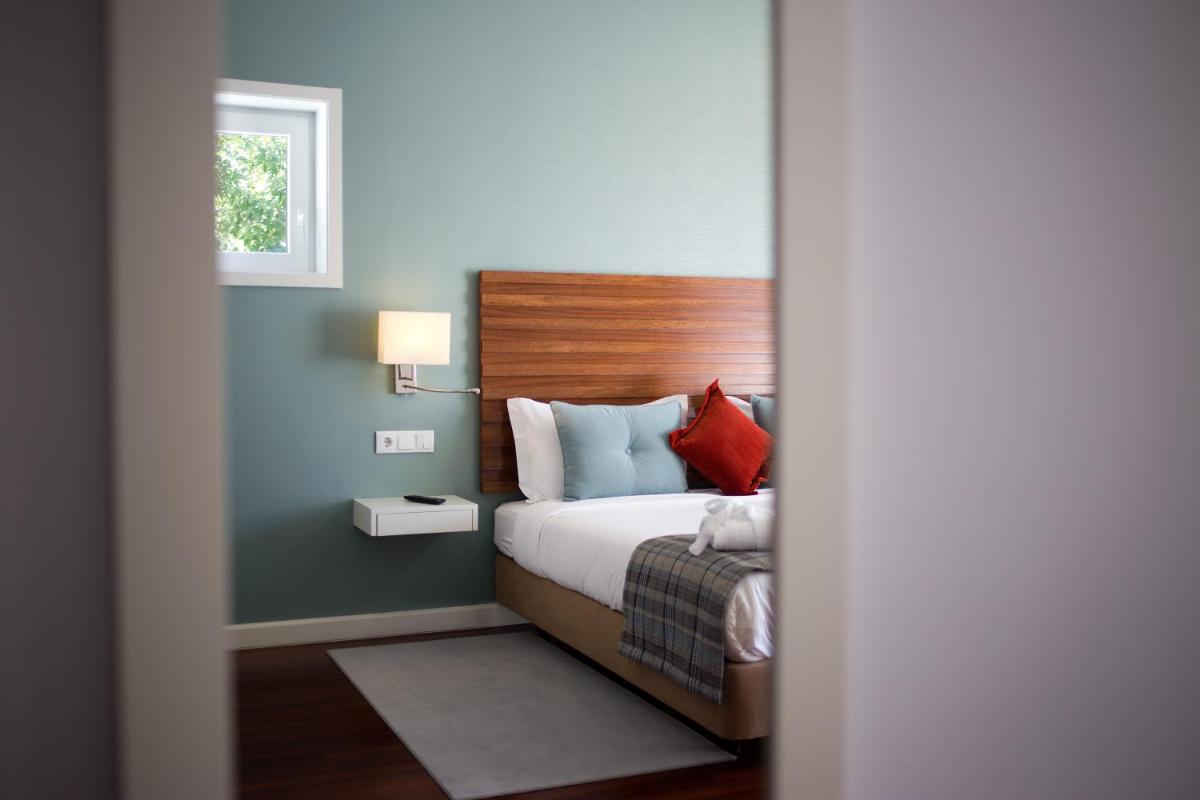 Uma cama ou camas num quarto em Hotel São Bento da Porta Aberta & Spa