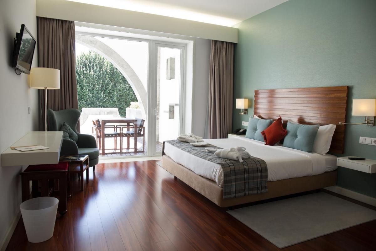 Uma cama ou camas num quarto em Hotel São Bento da Porta Aberta & Spa