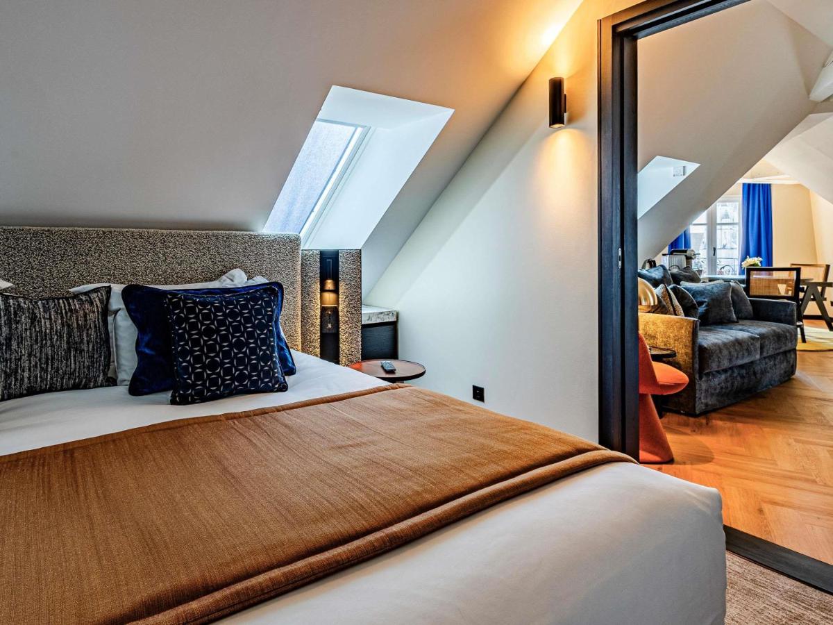 Un ou plusieurs lits dans un hébergement de l'établissement Grand Hôtel La Cloche Dijon - MGallery Collection