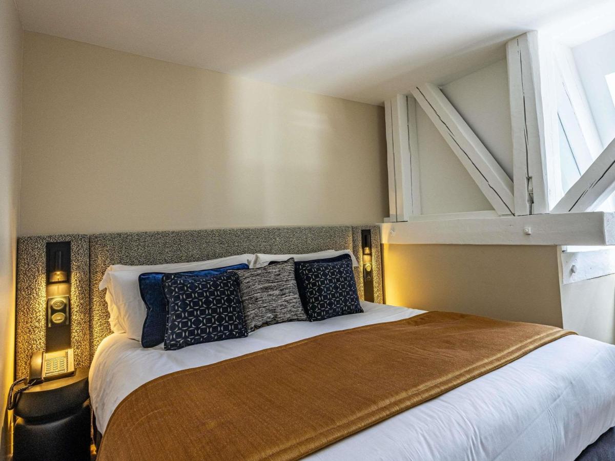 Un ou plusieurs lits dans un hébergement de l'établissement Grand Hôtel La Cloche Dijon - MGallery Collection