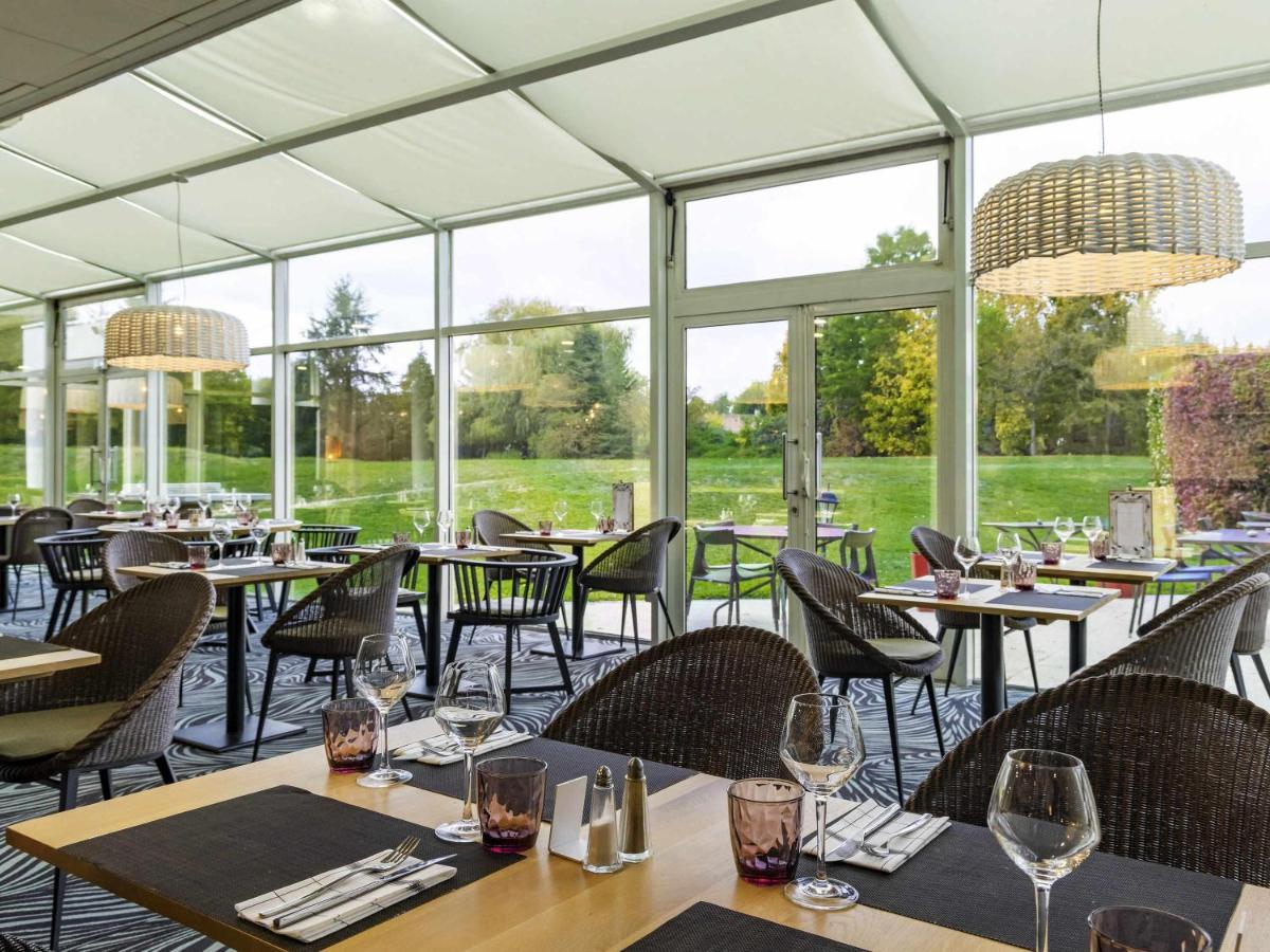 Restaurant ou autre lieu de restauration dans l'établissement Novotel Senart Golf De Greenparc