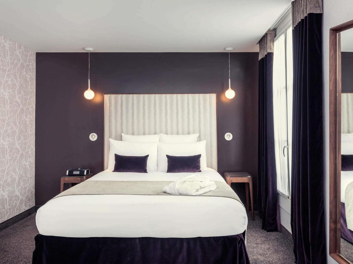 Un ou plusieurs lits dans un hébergement de l'établissement Mercure Paris Opera Garnier Hôtel & Spa