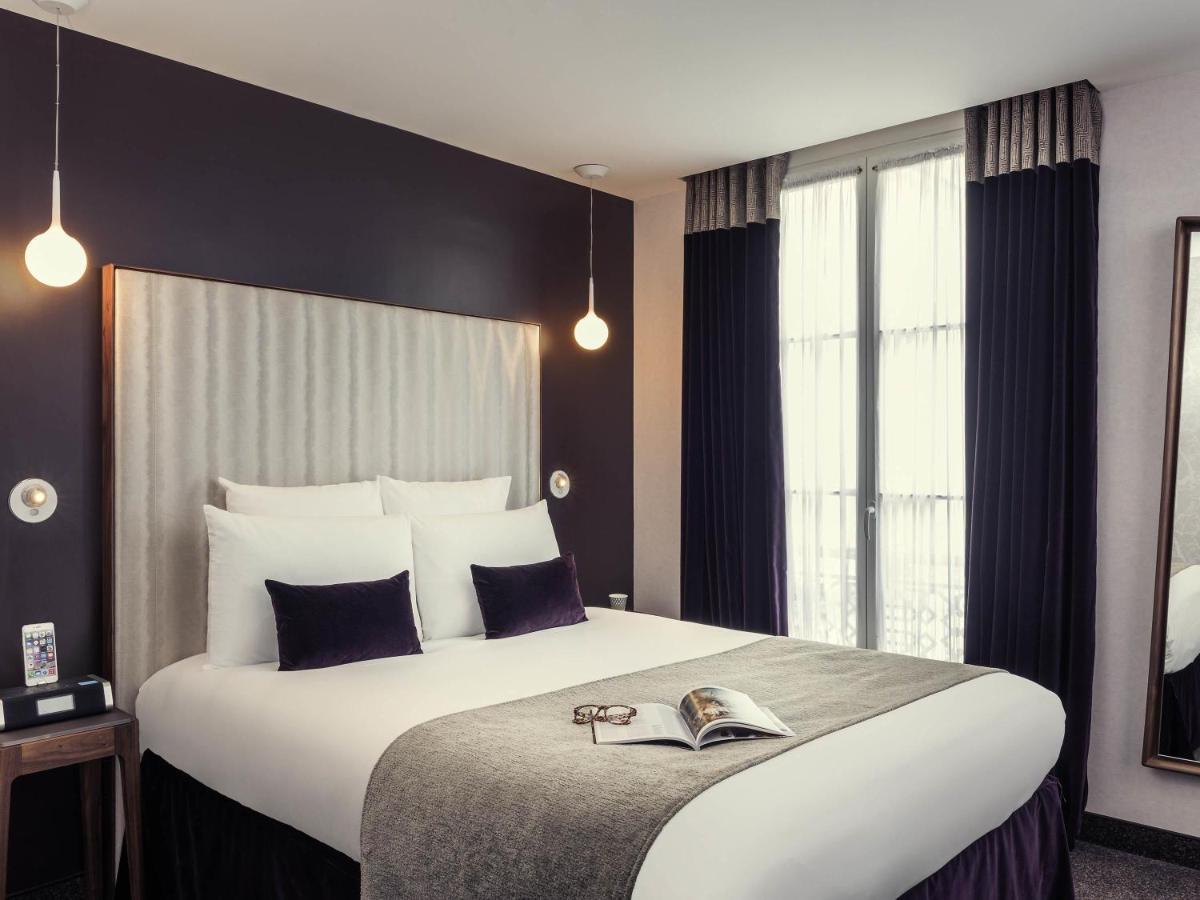Un ou plusieurs lits dans un hébergement de l'établissement Mercure Paris Opera Garnier Hôtel & Spa