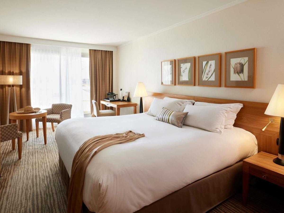 Un ou plusieurs lits dans un hébergement de l'établissement Sofitel Biarritz Le Miramar Thalassa