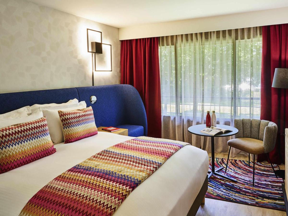 Un ou plusieurs lits dans un hébergement de l'établissement Cabot Hotel Bordeaux - MGallery Collection