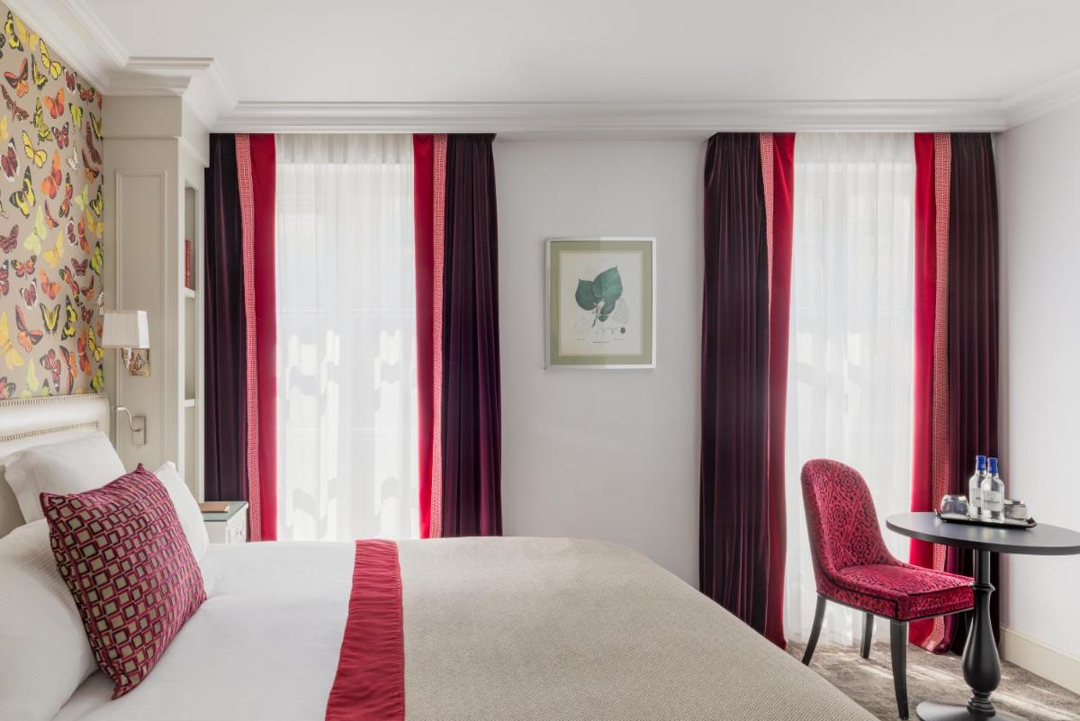 Un ou plusieurs lits dans un hébergement de l'établissement Hotel Monge