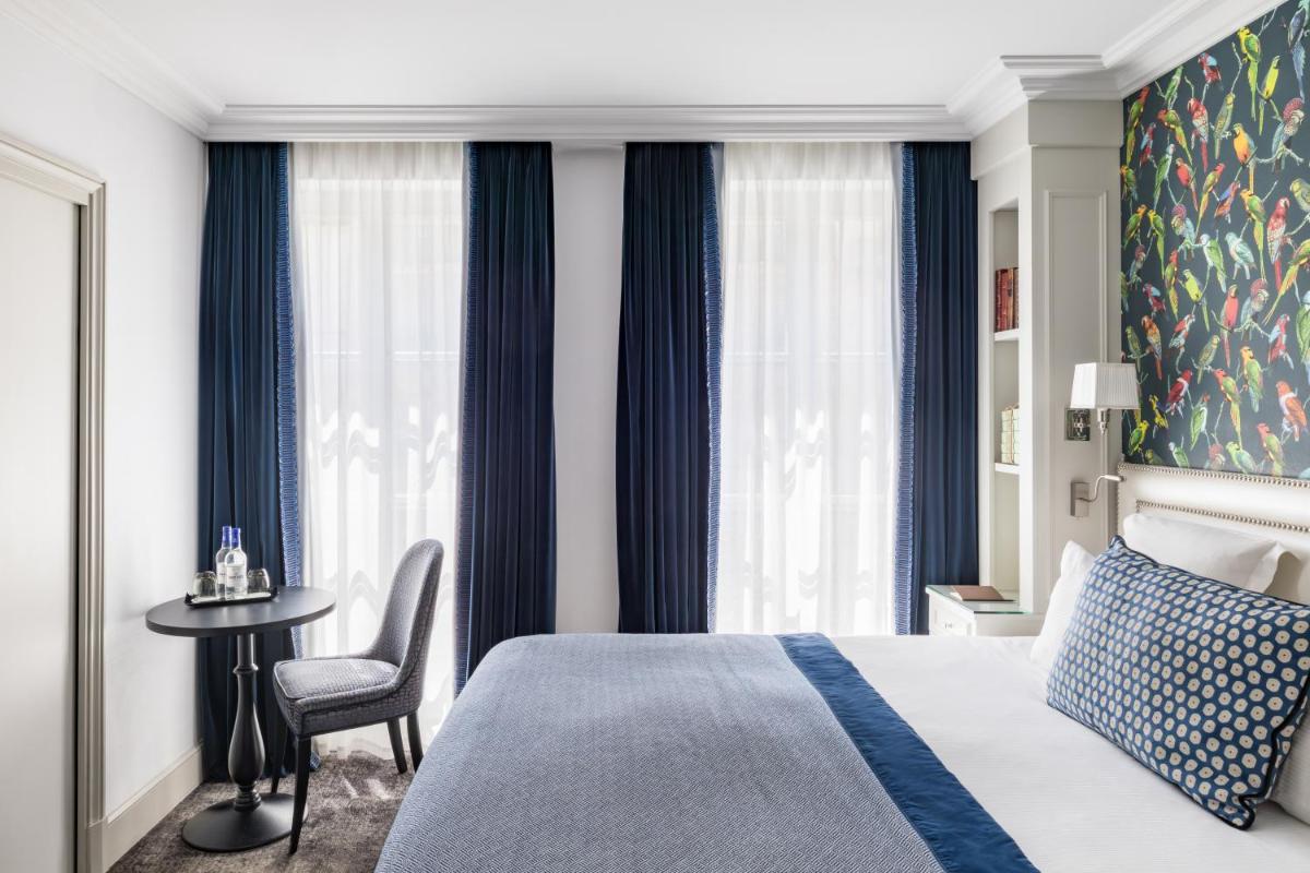 Un ou plusieurs lits dans un hébergement de l'établissement Hotel Monge