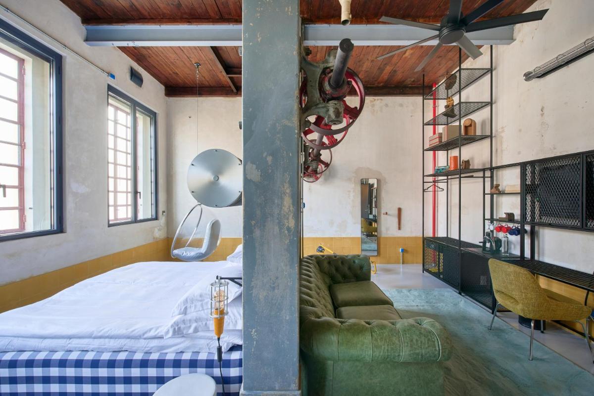 Uma cama ou camas num quarto em Moagem Industrial Lodge