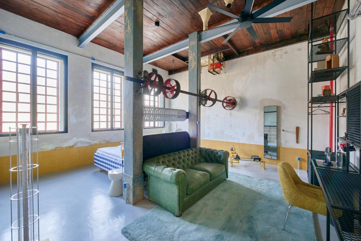 Uma área de estar em Moagem Industrial Lodge