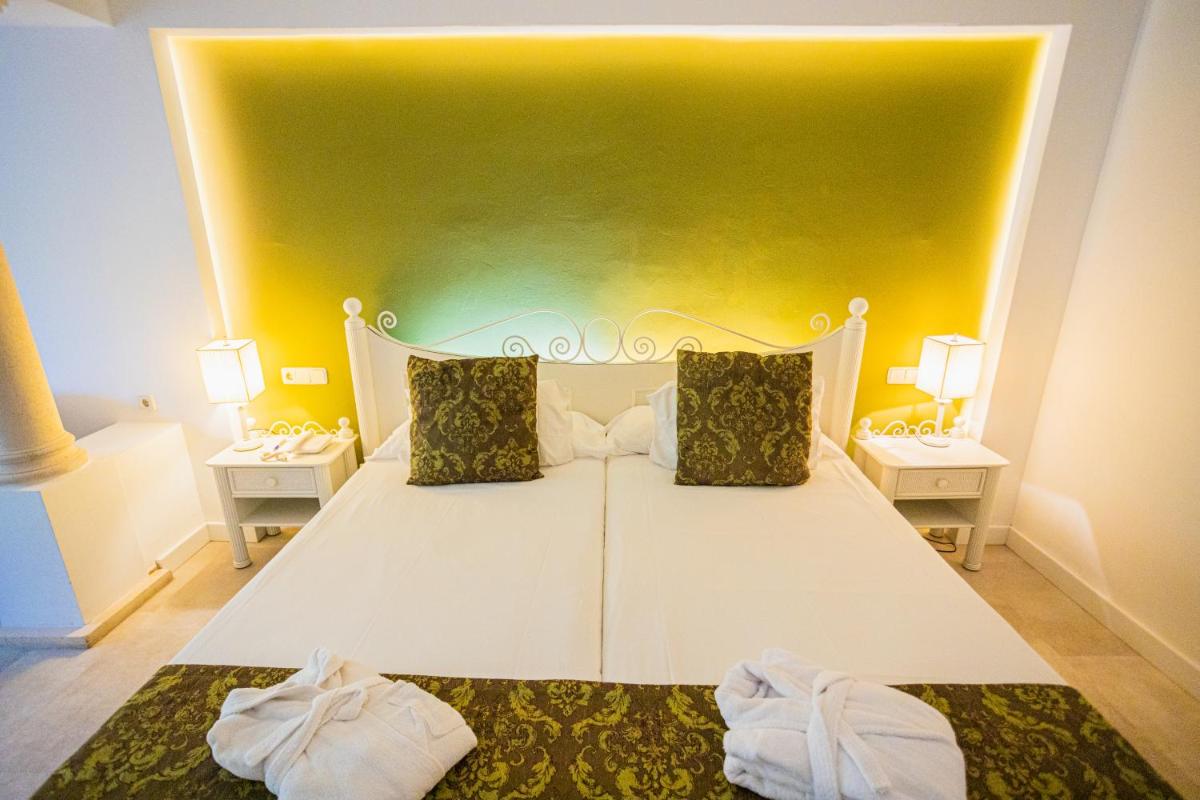 Cama o camas de una habitación en Lago Garden Apart-Suites & Spa Hotel