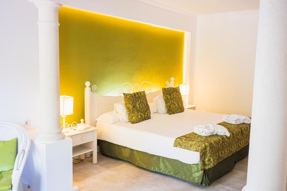 Cama o camas de una habitación en Lago Garden Apart-Suites & Spa Hotel