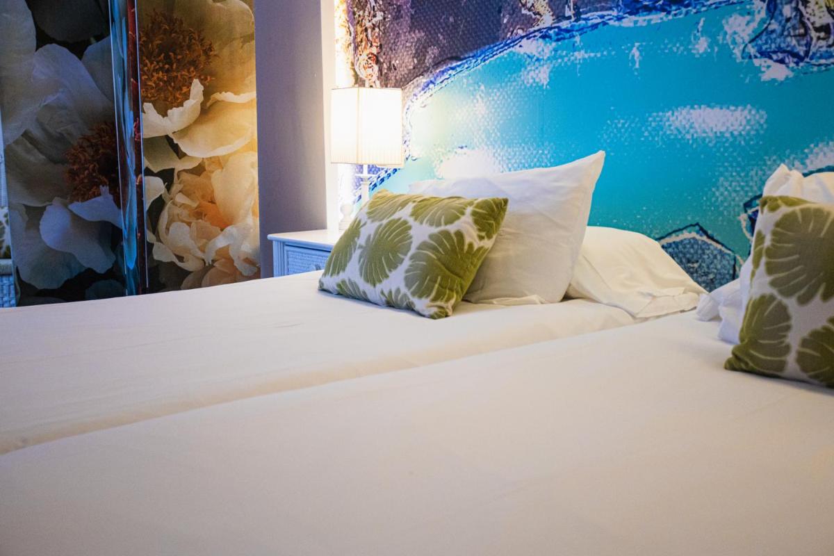 Cama o camas de una habitación en Lago Garden Apart-Suites & Spa Hotel