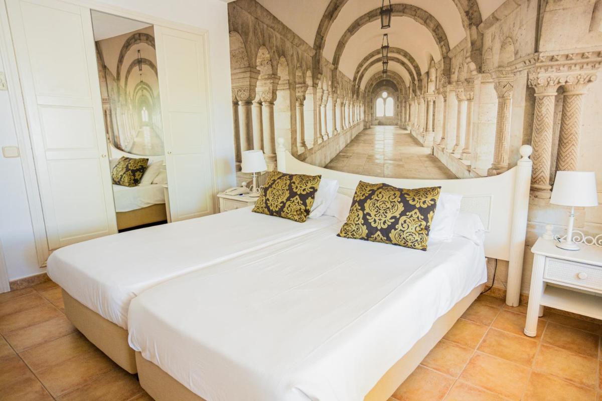 Cama o camas de una habitación en Lago Garden Apart-Suites & Spa Hotel