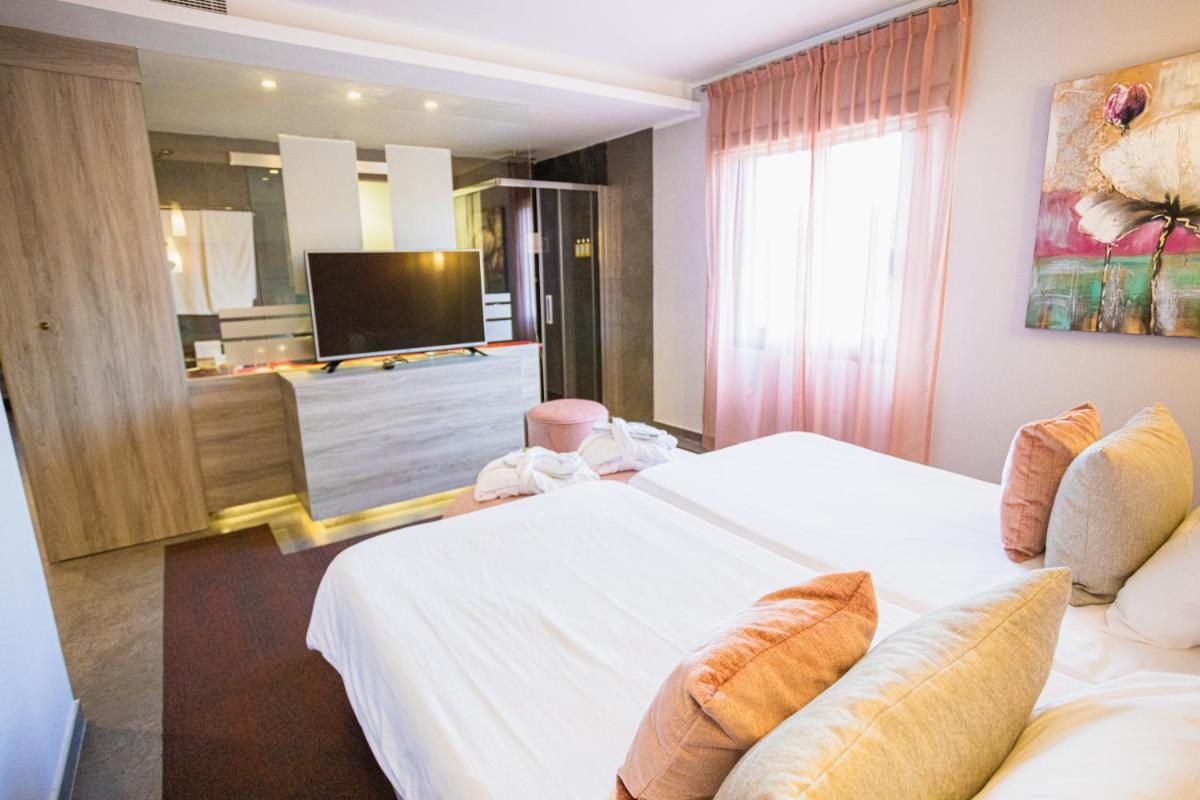 Cama o camas de una habitación en Lago Garden Apart-Suites & Spa Hotel